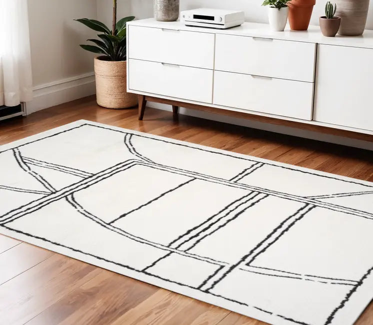 Ivory And Black Geometric Area Rug
